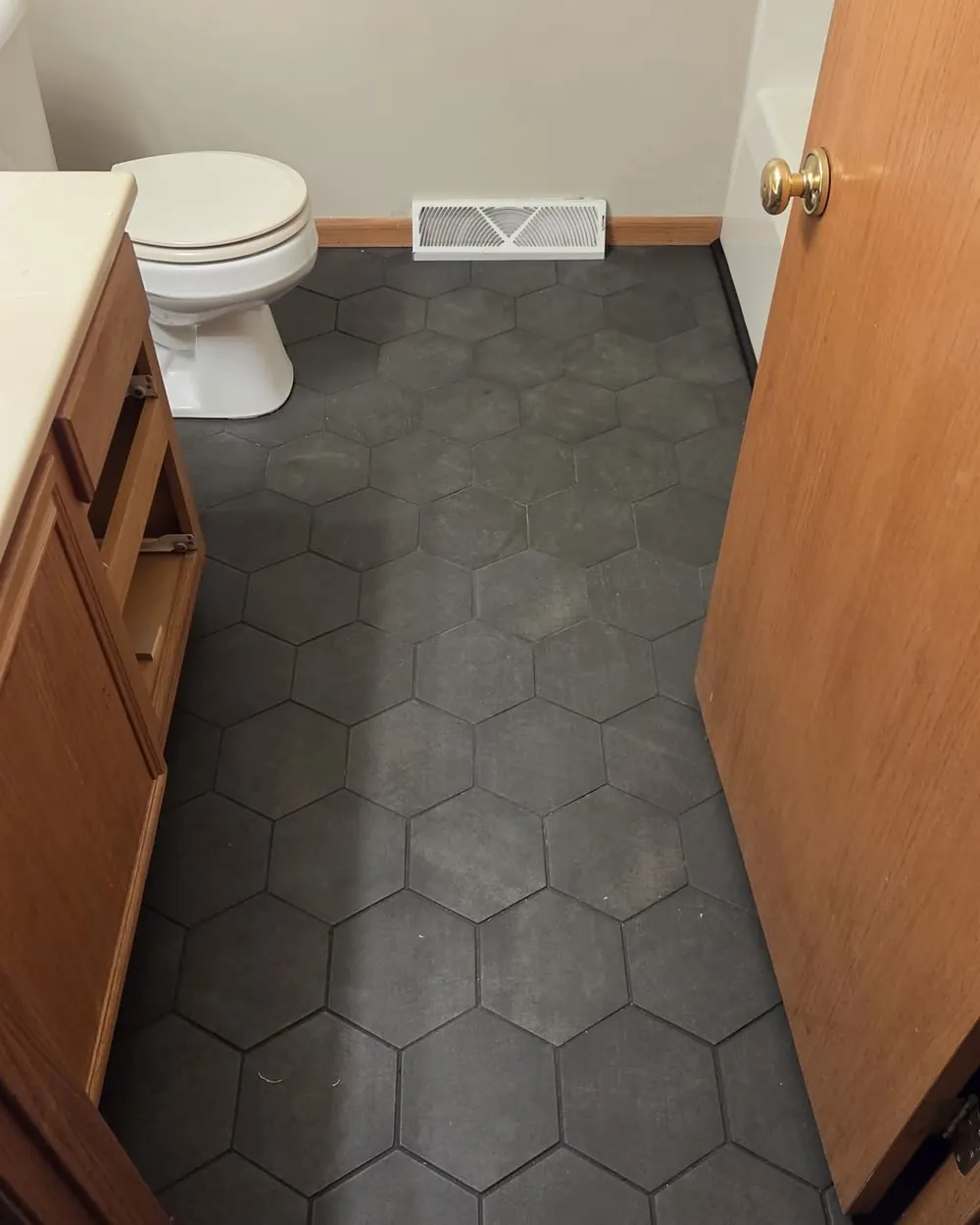 Bathroom floor with new hexagon tile installed